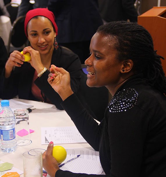 Quahiera Constant and Moagabo Ragoasha (oceanographer, foreground) prepare their pitches.