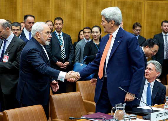 Foreign Minister of Iran, Mohammad Javad Zarif shakes hands with US Secretary of State John Kerry at the last working session of the Iran negotiations leading to the JCPOA.