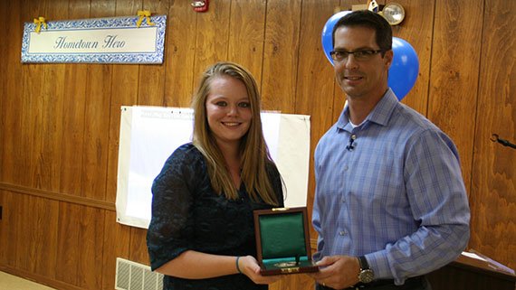 Ashley Marie Aldridge being presented with the Carnegie Medal by Eric Zahren, executive director of the Carnegie Hero Fund Commission (Photo: South County Publications)