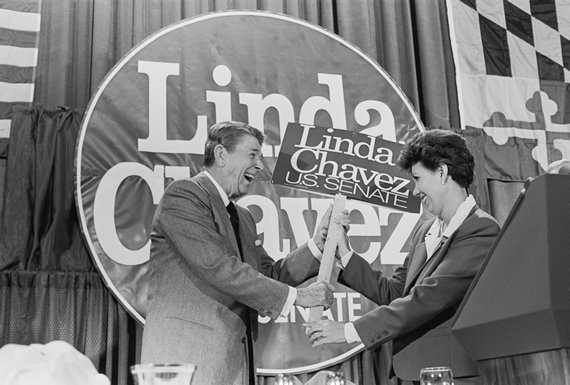 President Reagan gleefully accepts a campaign placard from Maryland Republican Senate candidate Linda Chavez (Credit: Bettmann/Getty Images)