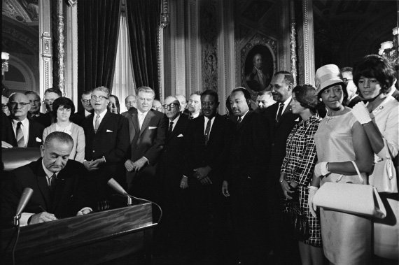 President Lyndon Johnson signs the Voting Rights Act in 1965