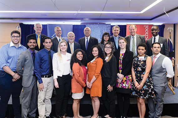 General Colin Powell (back row, fourth from left) posing with participants and attendees of the May 2016 Carnegie Forum on immigrant access to higher education. (Photo: Filip Wolak Photography)