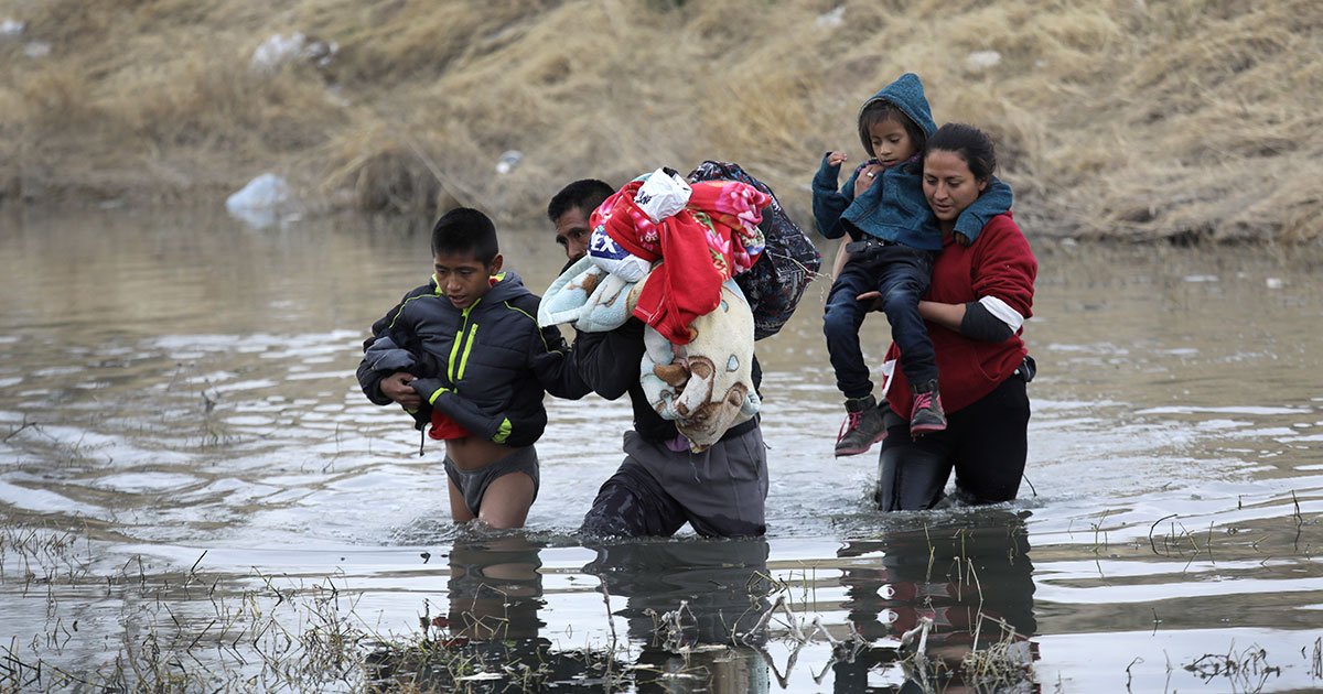 Immigrants from Central America wade across the Rio Grande from Mexico into the U.S. at El Paso, Texas, in early February 2019. They later turned themselves in to U.S. Border Patrol agents, seeking political asylum. (Photo: John Moore/Getty Images)