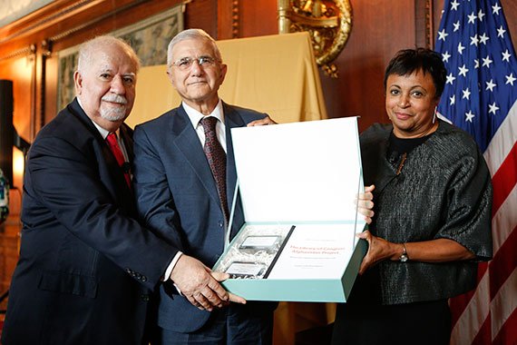 Carnegie Corporation president Vartan Gregorian, Afghan Minister of Information and Culture Abdul Bari Jahani, and Librarian of Congress Carla Hayden display a box of hard drives that contain the documents digitized through the Afghanistan Project.
