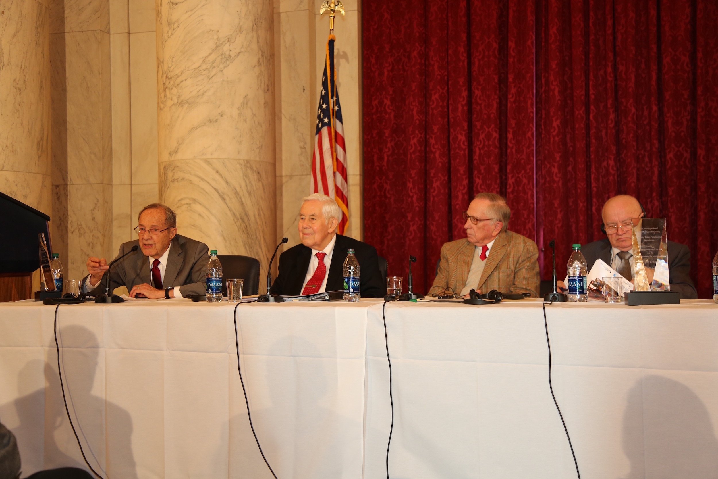 (l–r) Former defense secretary William Perry with former senators Lugar and Nunn, and General Viktor Esin, accepting for General Evgeny Maslin (Photo: Celeste Ford)
