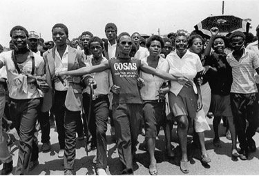 Students marching to a funeral, 1981. Photo by Omar Badsha