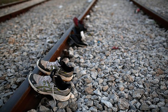 The shoes of three Syrian migrants are laid on a railroad track to dry out after a long walk to a border crossing on the Greek and Macedonian border September 2, 2015 near Idomeni, Greece. (Win McNamee Getty Images)