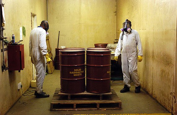 Workers checking radioactive waste drums at a Nesca (Nuclear Energy Corporation of South Africa) site, Pretoria, South Africa, May 5, 2005. (Photo: Gianluigi Guercia/AFP/Getty Images)