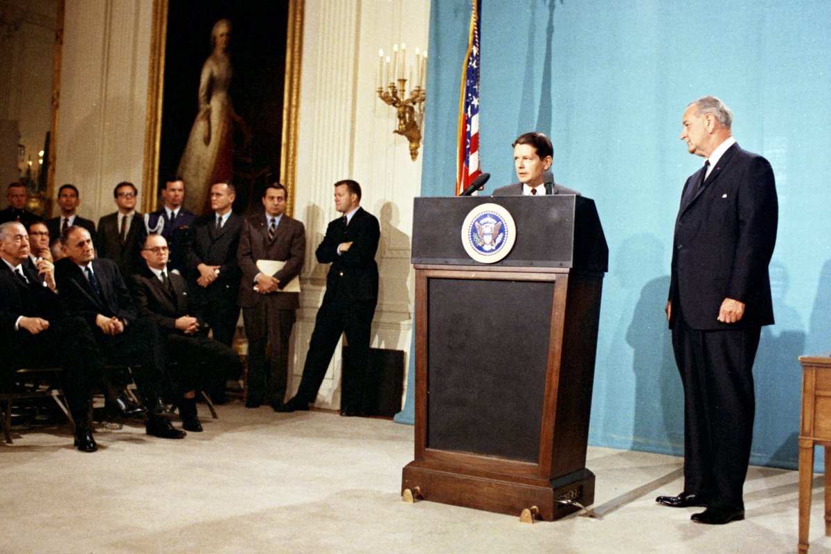 Alan Pifer, the Corporation's third president, at the podium addresses the crowd as President Lyndon B. Johnson stands to his left on the day of the signing of the Public Broadcasting Act, in the East Room of the White House, Washington D.C., November 7, 1967. (Yoichi Okamoto/Interim Archives/Getty Images)