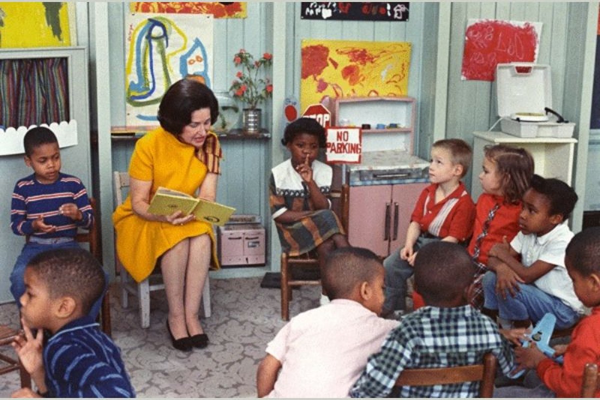First Lady Lady Bird Johnson reads to students at a federally funded Project Head Start at the Kemper School in Washington, DC in 1966. (National Archives) 