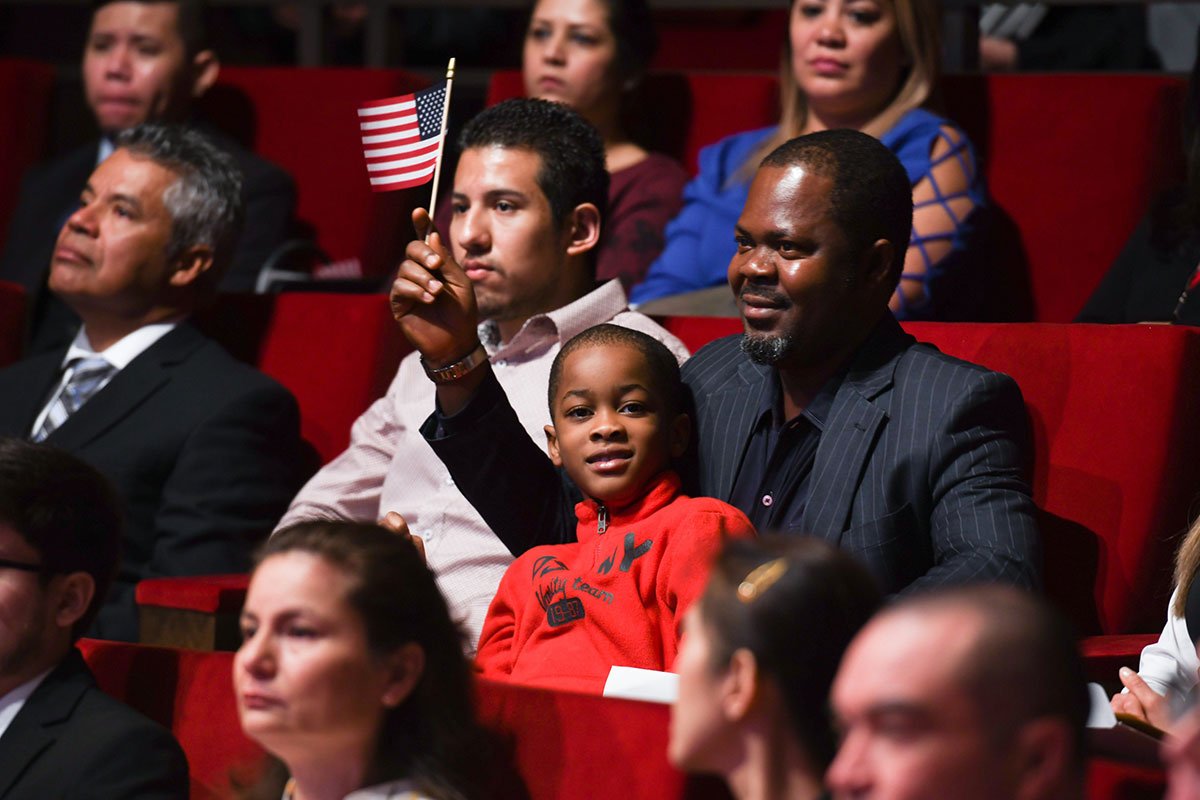 Immigrants participate in an official naturalization ceremony at the George W. Bush Institute in March 2019. 