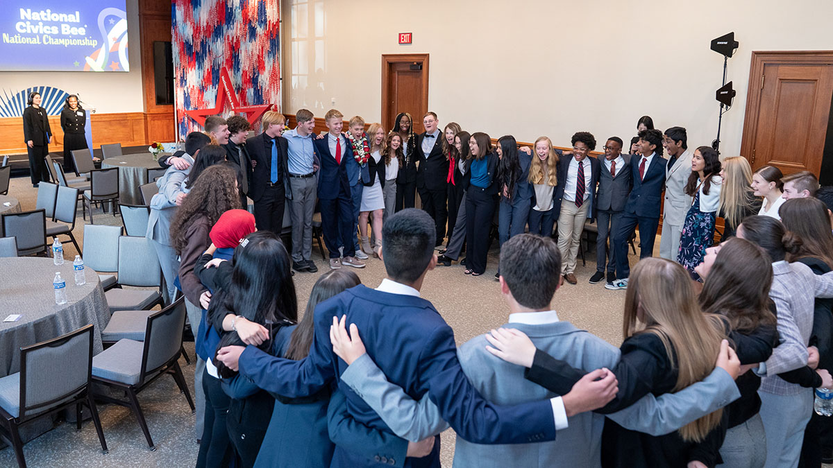 Students huddle in a large circle