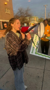 A girl with a megaphone at a community event
