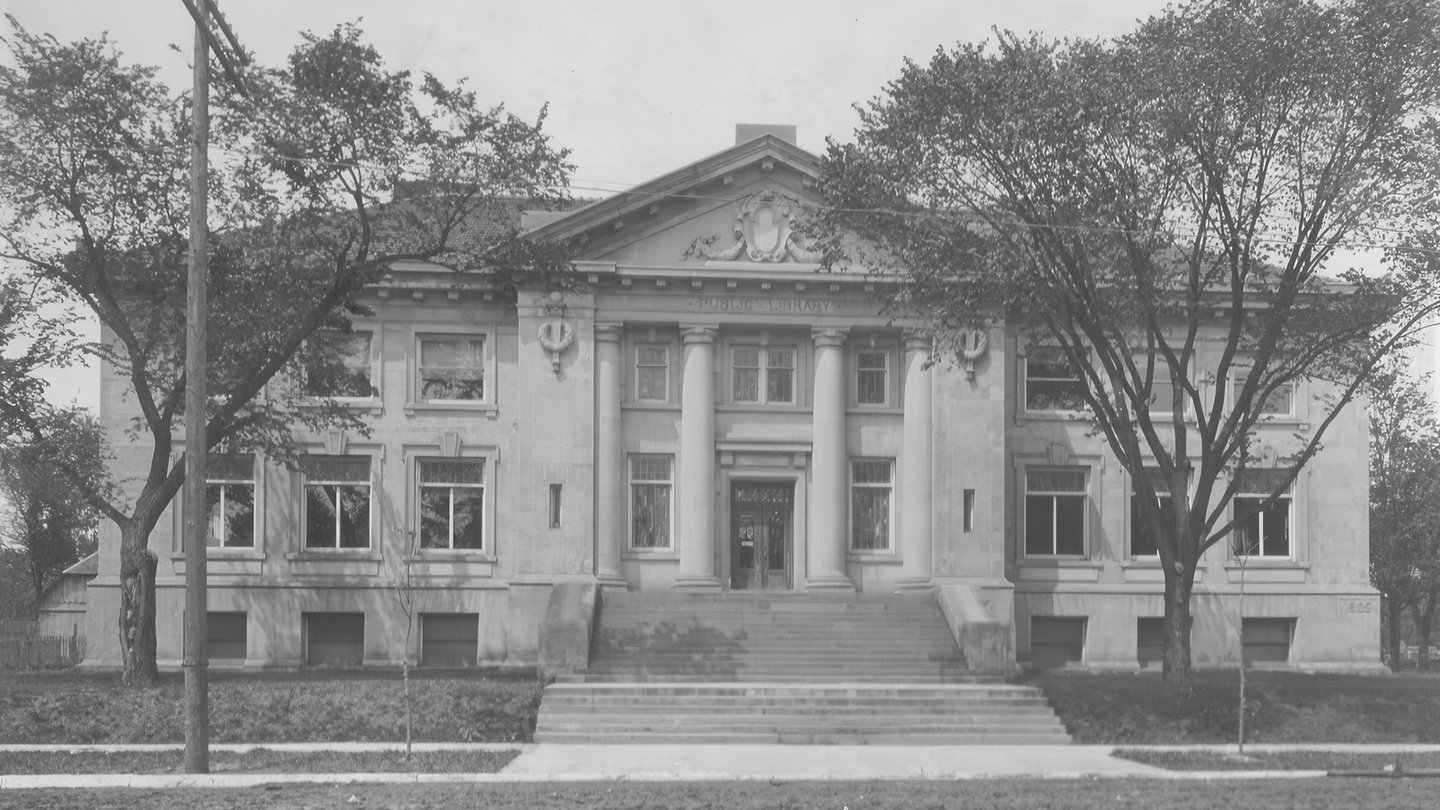 The front of a Carnegie library building in black and white
